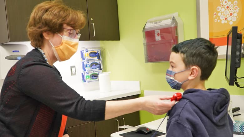 Dr. Berry examining a patient