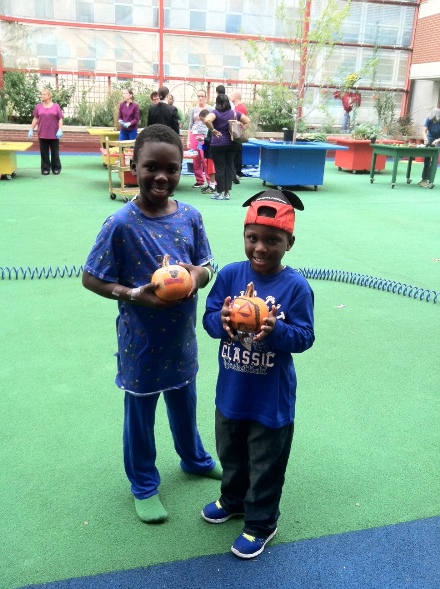 Patients paint pumpkins in the Sea Garden at CHOP.