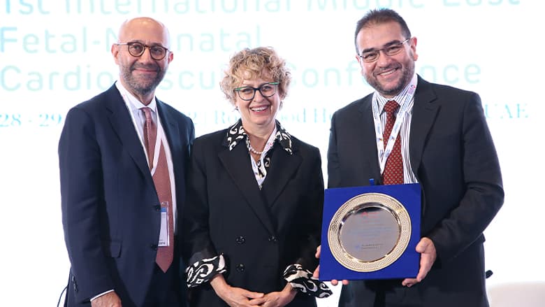 People holding an award