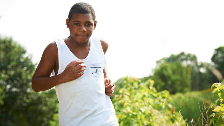 staying in shape during covid-19 boy running outside