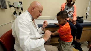Doctor examining Hand Transplant Patient