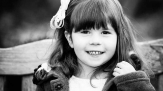 black and white portrait young girl smiling outside
