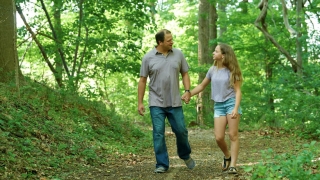 father and daughter walking