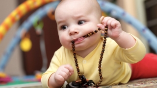 baby with beads