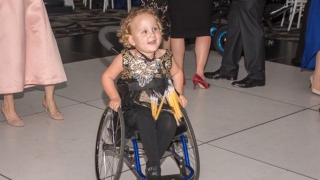 Claire on the dance floor in her wheelchair dancing