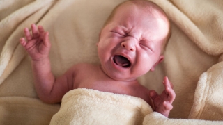 infant with colic crying