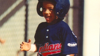young roberto playing baseball