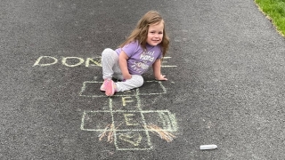 Molly with her hopscotch board