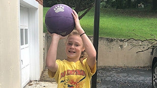 Emily holding a basketball
