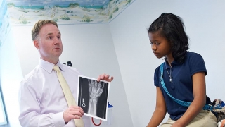 Doctor and child looking at X-rays