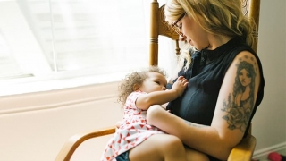 Mother breastfeeding child