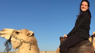 Jessica CF patient riding a camel in Israel