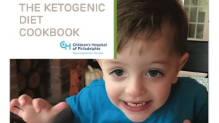Kid smiling on cover of Ketogenic Diet Cookbook