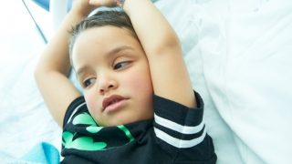 Little boy in hospital laying down