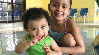 Lucas with his sister at the pool