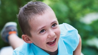 Max oncology patient smiling playing outside