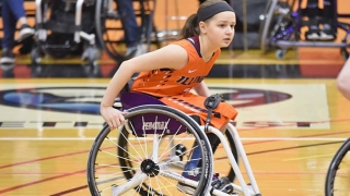Ruby playing wheelchair basketball
