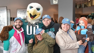 Group photo with Eagles mascot, Swoop