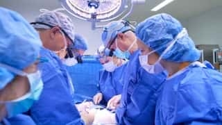 doctors operating on fetal surgery patient for spina bifida