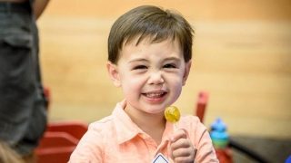 boy holding lollipop
