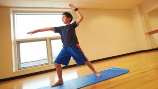 boy practicing yoga