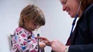 Primary Care visit - young girl with doctor
