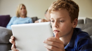Boy looking at tablet