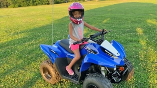 Miah riding an ATV