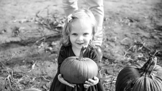 Violet holding a pumpkin