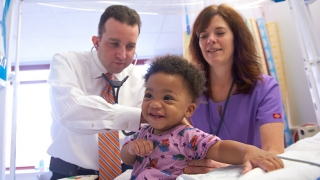 Two doctors examining child