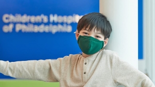 Adolescent boy wearing protective mask