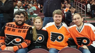 Zane with his siblings at a flyers game