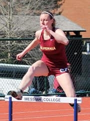 Abby jumping the hurdles