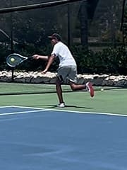 Rohan playing tennis