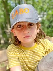 Gabo wearing a hat with his name on it
