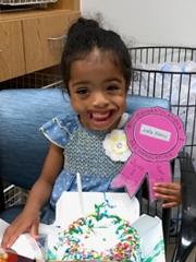 Lilly holding her birthday cake