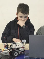 Logan at a computer