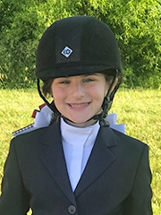 Georgia wearing her equestrian helmet