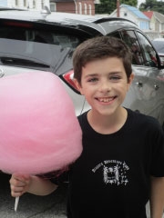 Food allergy patient holding cotton candy smiling