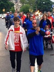 John Rosati of New Jersey carries the torch for part of the Special Olympics Unified Relay Across America