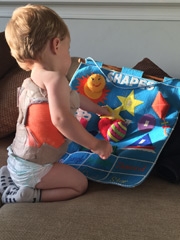 Tristan wearing back brace playing with toys