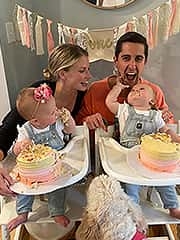 Athena (left) and Josephine (right) enjoy their first birthday with parents Kate and Matt.