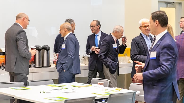 Participants mingling at council breakfast meeting in November 2019