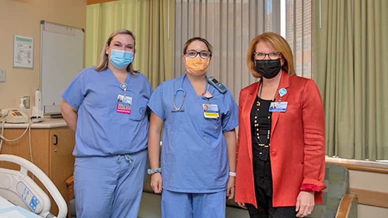 Madeline Bell with two Fetal staff members