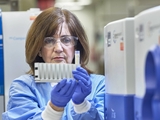 Researcher wearing protective gear in research lab