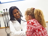 Doctor checking patient in primary care office