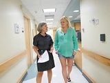 Administrator walks with mother