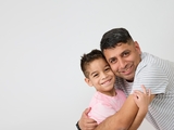 Father hugging son