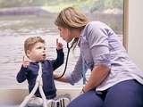 Young child being examined by doctor