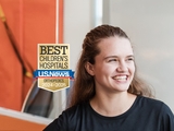 Ortho patient Ella with US News 2024-25 Badge